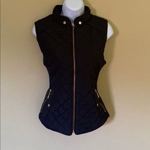 Black vest with brown trim